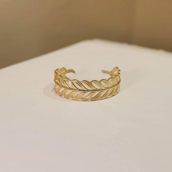 Un tressage doré, une allure intemporelle – Bracelet rigide tressé